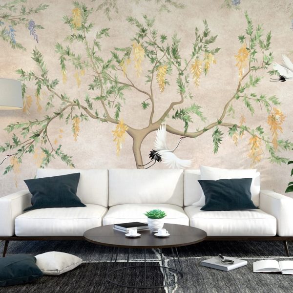 Foto murale Tre vinça fluturues dhe një pemë